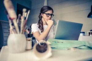 woman sitting at her desk